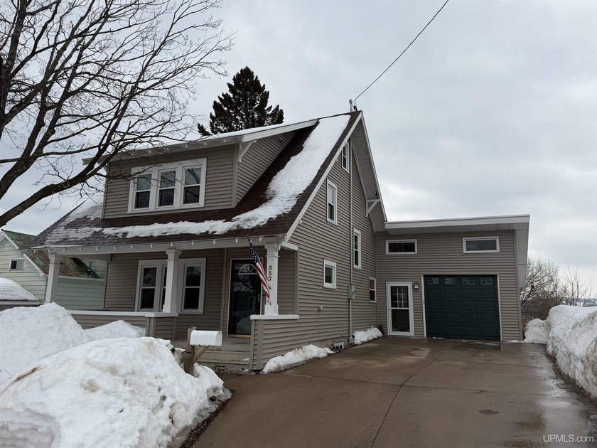 Beautifully maintained Craftsman-style home in the heart of - Beach Home for sale in Marquette, Michigan on Beachhouse.com