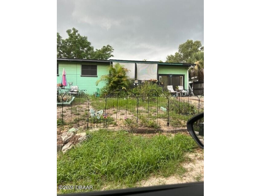 PRICE REDUCED! OWNER EAGER TO SELL! This three bedroom, one and - Beach Home for sale in Daytona Beach, Florida on Beachhouse.com