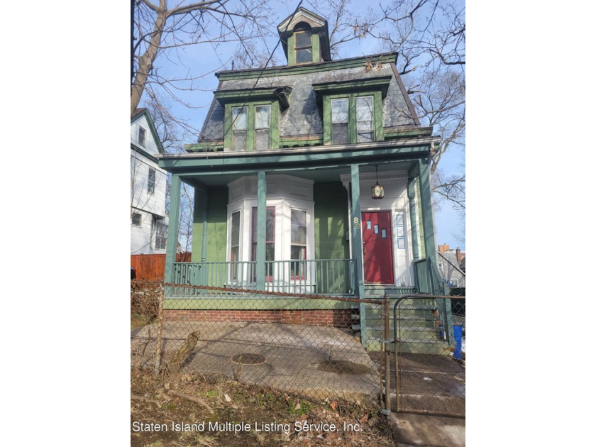 Situated on a 45' X 100' lot, this unique colonial home presents - Beach Home for sale in Staten Island, New York on Beachhouse.com