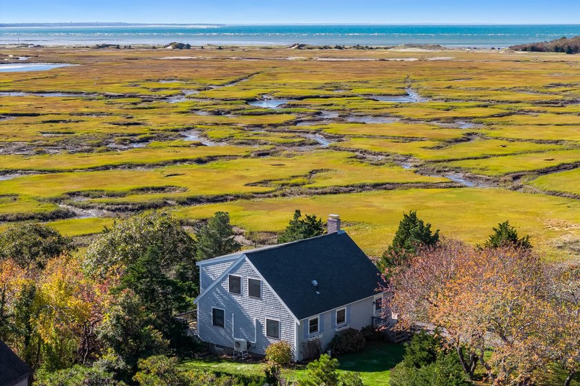 Overlooking an expansive salt marsh with views toward Cape Cod - Beach Home for sale in Eastham, Massachusetts on Beachhouse.com