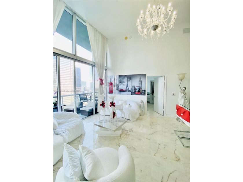 An exquisite 2-bed 2-bath + den residence with breathtaking 16ft - Beach Condo for sale in Miami, Florida on Beachhouse.com