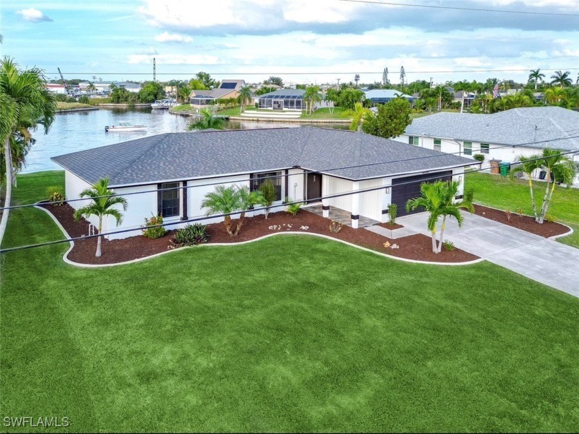 Discover your dream retreat in beautiful SE Cape Coral! This - Beach Home for sale in Cape Coral, Florida on Beachhouse.com