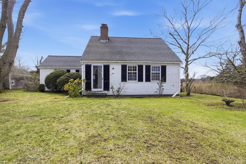Perched above the marsh along Rock Harbor Creek, this classic - Beach Home for sale in Orleans, Massachusetts on Beachhouse.com