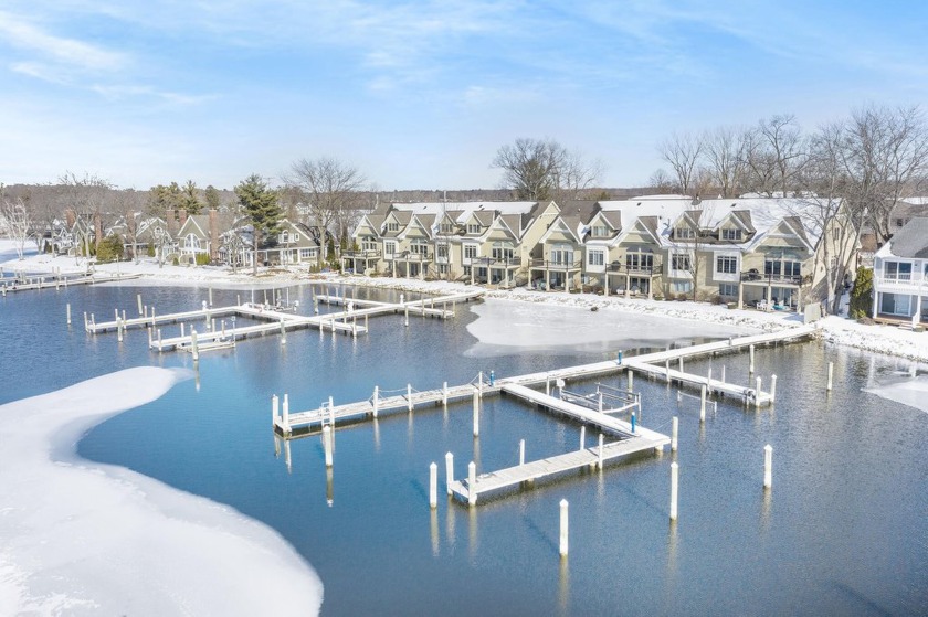 Waterfront living and modern luxury await in this completely - Beach Condo for sale in Spring Lake, Michigan on Beachhouse.com