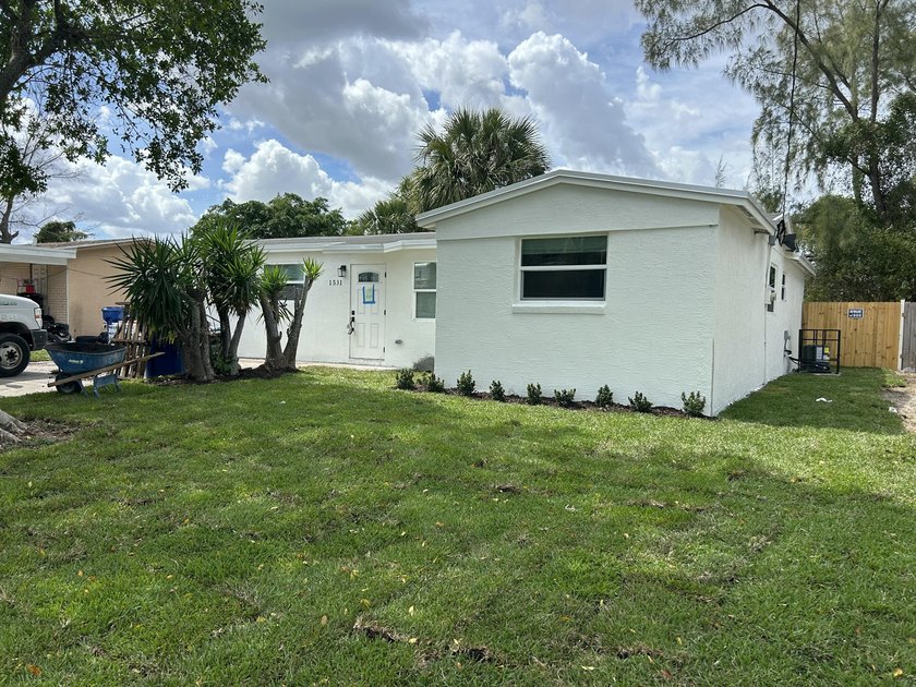 NO FHA!! Welcome to this reimagined single family home, nestled - Beach Home for sale in Riviera Beach, Florida on Beachhouse.com