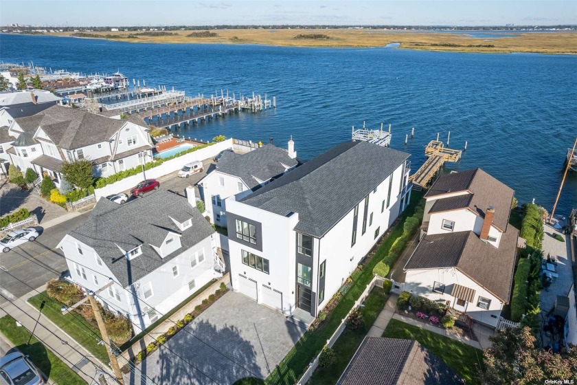 Experience Bayfront Modern Elegance in this 4,000 sq.ft. FEMA - Beach Home for sale in Long Beach, New York on Beachhouse.com