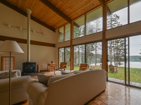 Mid-century modern home, the Deck House, features exposed post - Beach Home for sale in Swans Island, Maine on Beachhouse.com