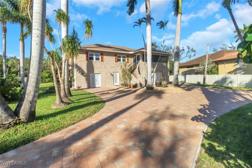 Behind the PRIVATE gates and sturdy brick wall sits your stately - Beach Home for sale in North Fort Myers, Florida on Beachhouse.com