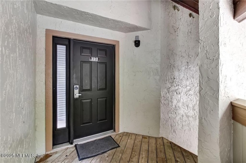 This second-floor, light-filled 2 bedroom, 2 bath Courtside - Beach Condo for sale in Fernandina Beach, Florida on Beachhouse.com
