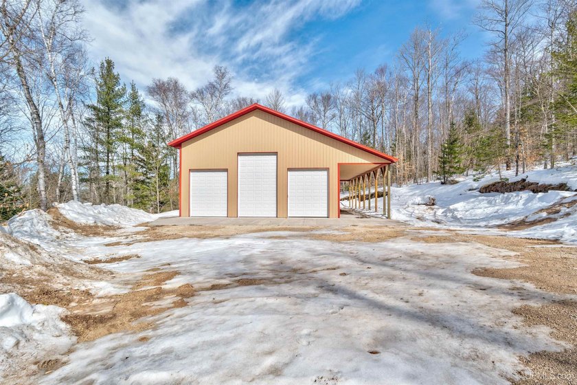 Build your dream home or cabin amongst the hardwoods on this 1 - Beach Lot for sale in Manistique, Michigan on Beachhouse.com