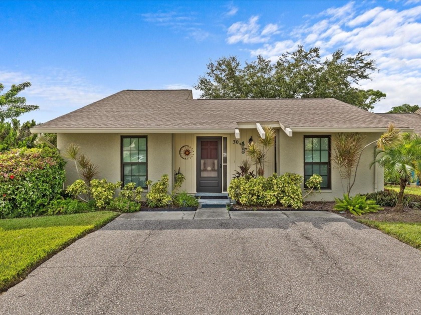 Discover a charming 2-bed, 2-bath standalone villa in Windrush - Beach Home for sale in Tarpon Springs, Florida on Beachhouse.com