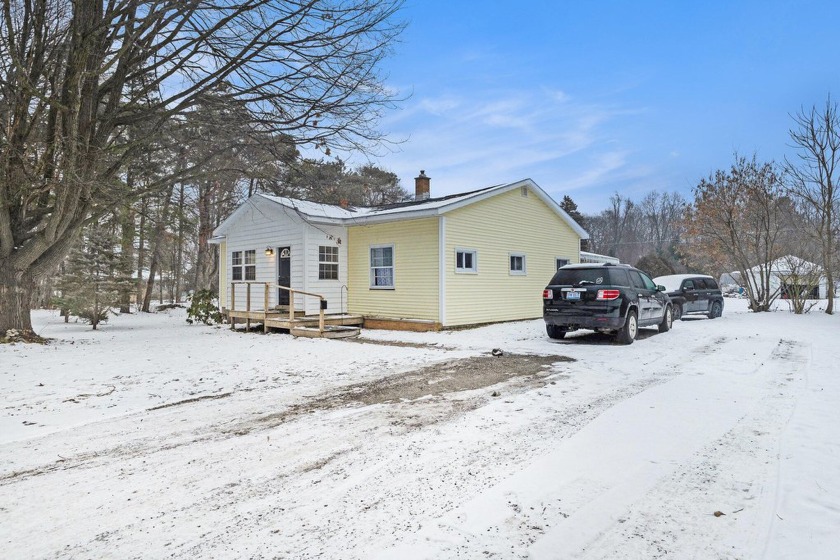 This delightful 4-bedroom home is situated on a spacious double - Beach Home for sale in Whitehall, Michigan on Beachhouse.com