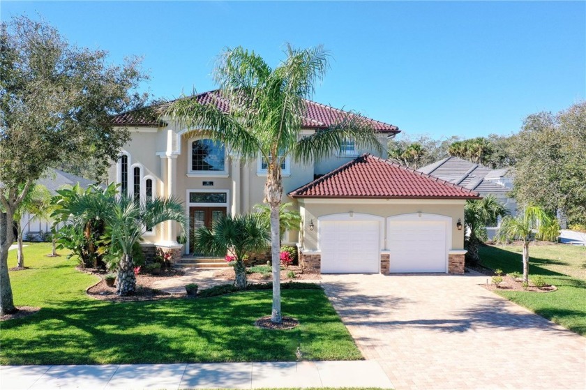 Experience luxurious living in this stunning Mediterranean - Beach Home for sale in Palm Coast, Florida on Beachhouse.com