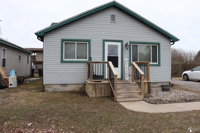 Welcome to this charming ranch-style home just a short stroll - Beach Home for sale in Monroe, Michigan on Beachhouse.com