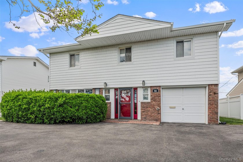 Welcome to this well maintained splanch-style home in the highly - Beach Home for sale in Lido Beach, New York on Beachhouse.com