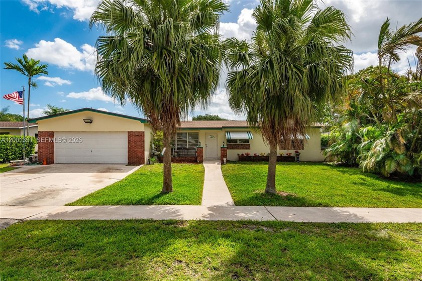 Located on a beautiful Cul-de-Sac street this pool home with - Beach Home for sale in Pembroke Pines, Florida on Beachhouse.com