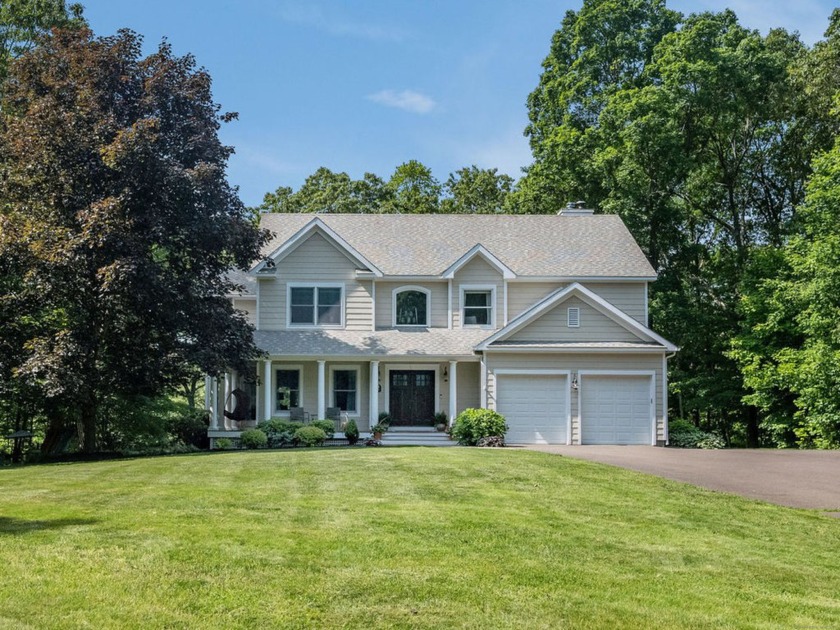 Sitting elegantly at the end of a private cul-de-sac and - Beach Home for sale in Guilford, Connecticut on Beachhouse.com