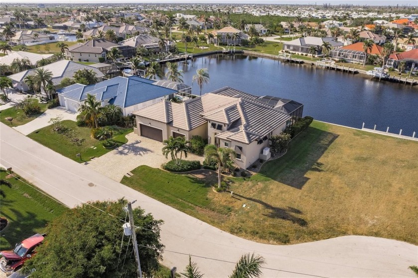 This 3 bedroom, 3 bath, sailboat waterfront pool home with 3 car - Beach Home for sale in Punta Gorda, Florida on Beachhouse.com