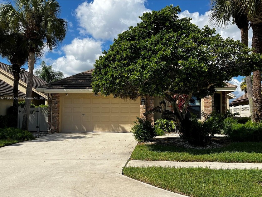 Great value and create equity with this CBS home on a small lake - Beach Home for sale in Boynton Beach, Florida on Beachhouse.com