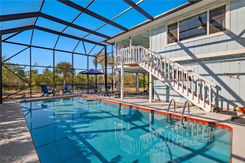 This whimsical elevated beach house is just 14 houses from the - Beach Home for sale in Sanibel, Florida on Beachhouse.com