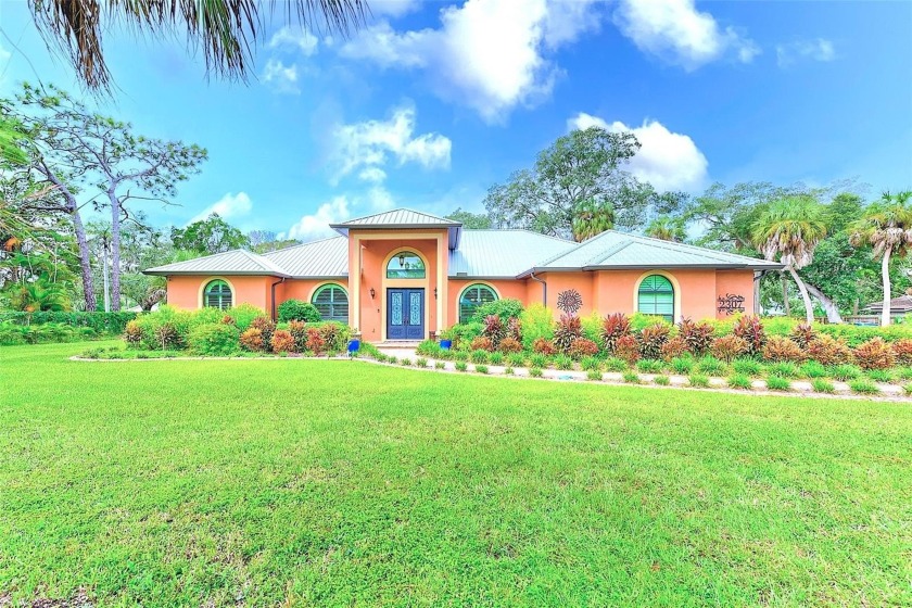 GULF-FRONT ESTATE! Discover the allure of timeless elegance in - Beach Home for sale in Ruskin, Florida on Beachhouse.com