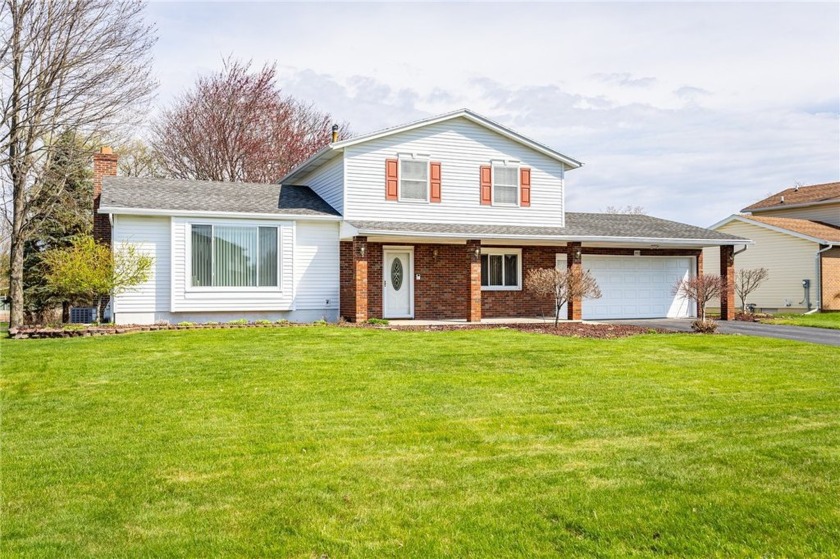 Meticulous maintenance shows throughout every corner in this - Beach Home for sale in Greece, New York on Beachhouse.com