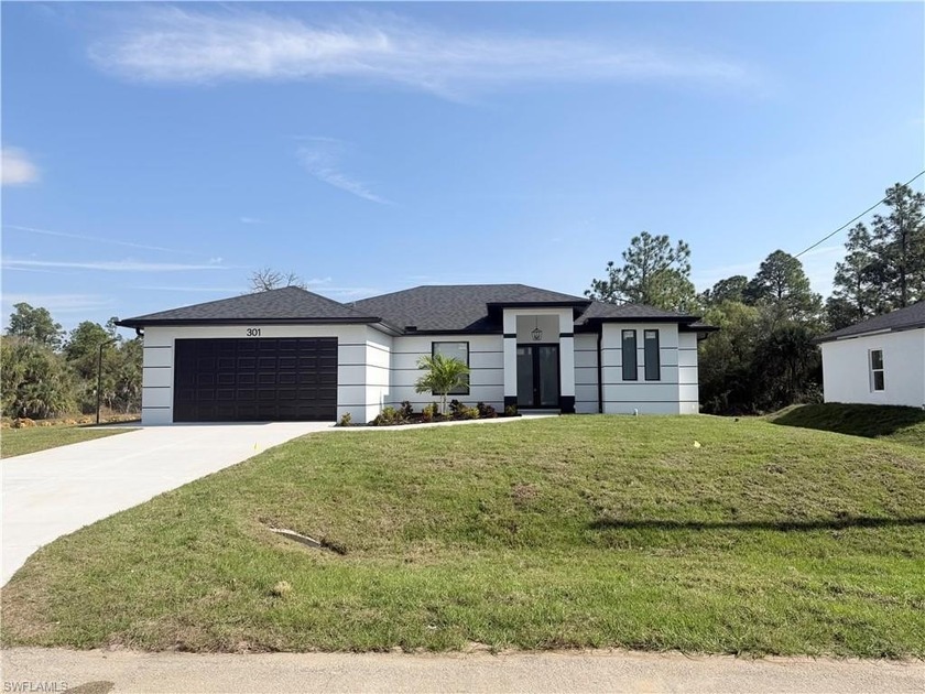 Stunning new construction home perfectly positioned on an - Beach Home for sale in Lehigh Acres, Florida on Beachhouse.com