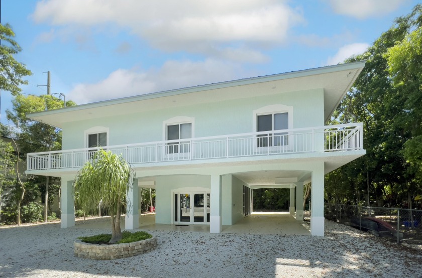 In the community of Rock Harbor Estates, sits this - Beach Home for sale in Key Largo, Florida on Beachhouse.com