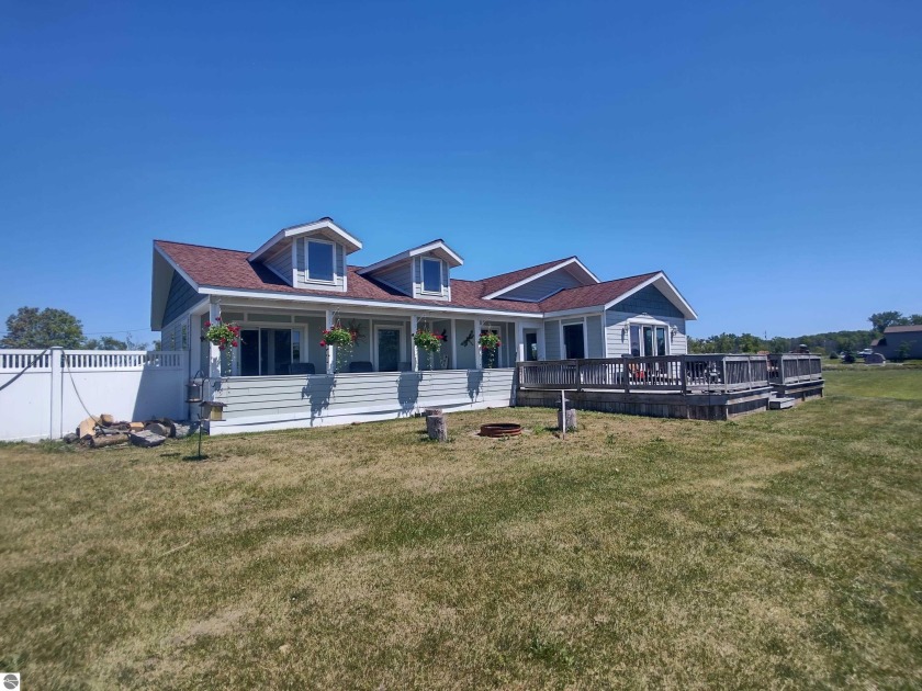 This spacious ranch home sits along a canal that leads right out - Beach Home for sale in Au Gres, Michigan on Beachhouse.com