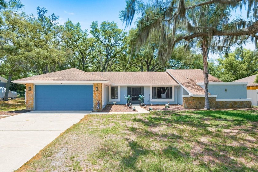Rare backyard flexibility in Spring Hill: fully fenced, mature - Beach Home for sale in Spring Hill, Florida on Beachhouse.com