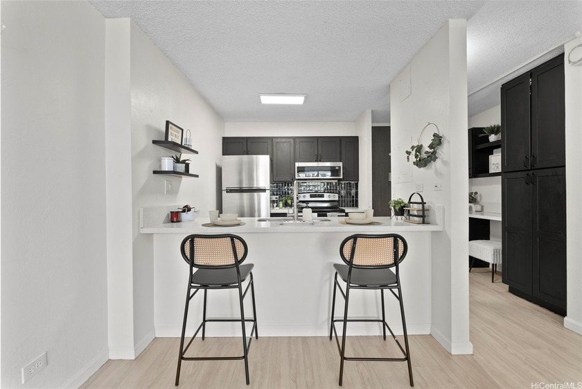 Move in ready, spacious low floor with treetop views. This - Beach Condo for sale in Aiea, Hawaii on Beachhouse.com