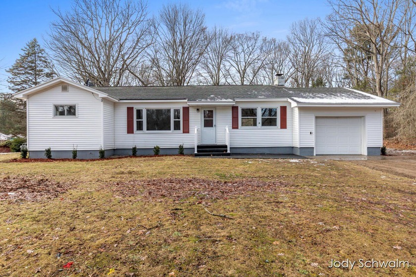 This surprisingly spacious ranch features 3 bedrooms and 2 - Beach Home for sale in Muskegon, Michigan on Beachhouse.com