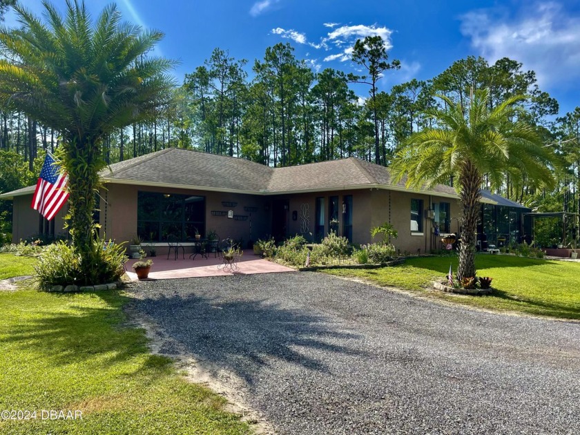 Country living close to town! This 4 bedroom/ 2 bath home sits - Beach Home for sale in Ormond Beach, Florida on Beachhouse.com