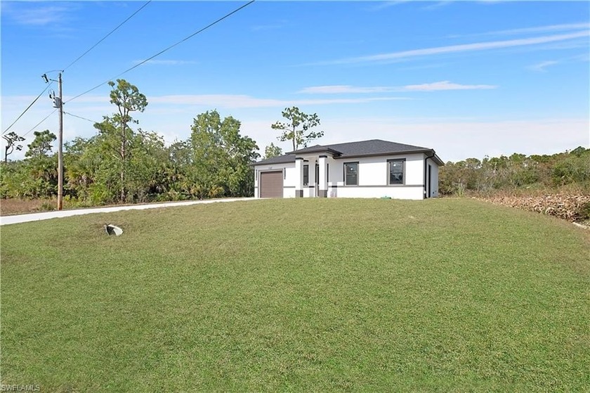Experience the pinnacle of contemporary new construction in this - Beach Home for sale in Lehigh Acres, Florida on Beachhouse.com