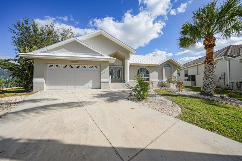 PGI waterfront home, three bedrooms, two baths on 140 feet of - Beach Home for sale in Punta Gorda, Florida on Beachhouse.com