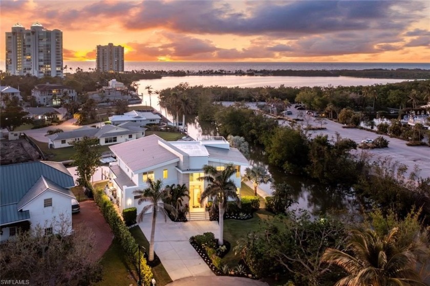 Nestled along Clam Pass, this stunning waterfront home is a true - Beach Home for sale in Naples, Florida on Beachhouse.com