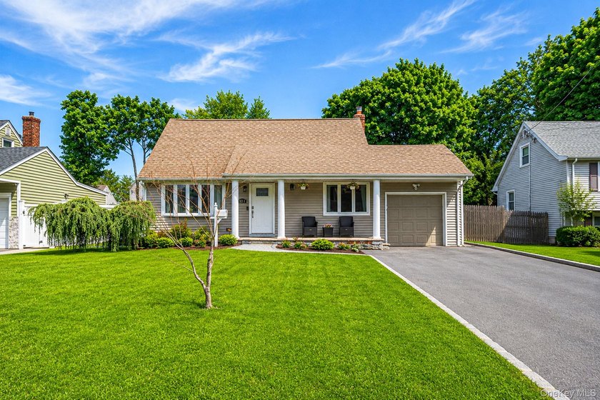 Welcome to this lovely updated Cape Cod-style home offering the - Beach Home for sale in North Babylon, New York on Beachhouse.com