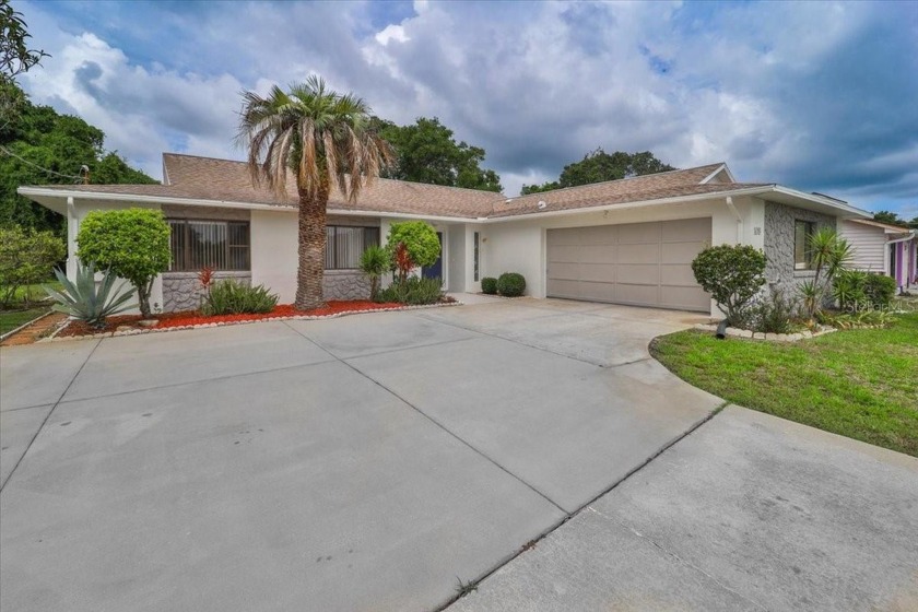 Located in the highly desirable Palm Harbor neighborhood of Palm - Beach Home for sale in Palm Coast, Florida on Beachhouse.com