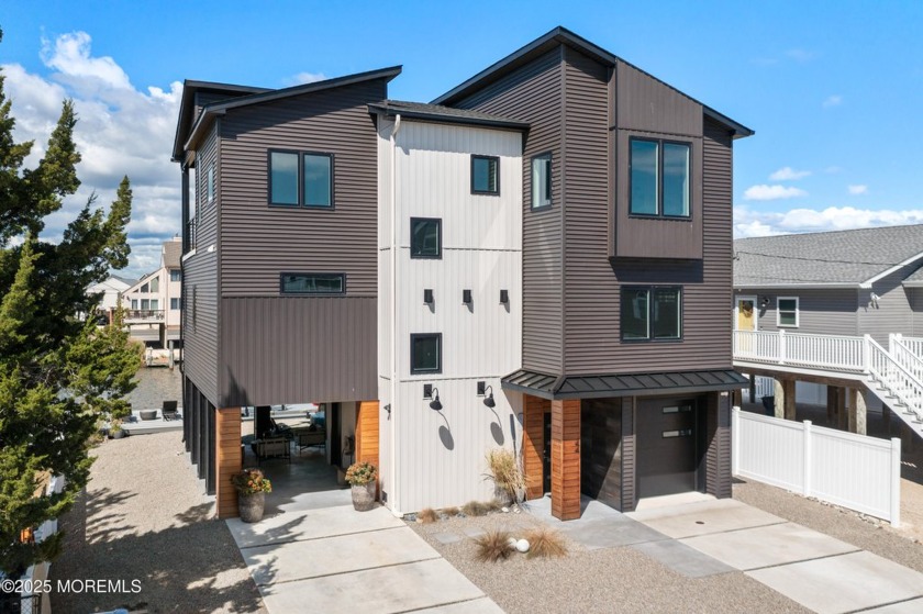 This stunning 3-bedroom, 2.5-bath waterfront home, built in 2022 - Beach Home for sale in Little Egg Harbor, New Jersey on Beachhouse.com