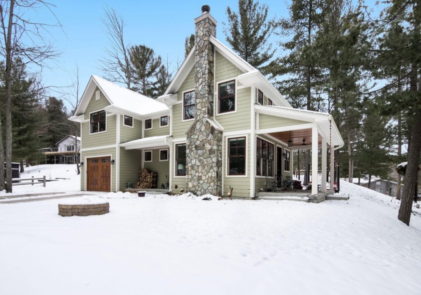 Nestled amongst the tall pines in the Pineview community, this - Beach Home for sale in Traverse City, Michigan on Beachhouse.com