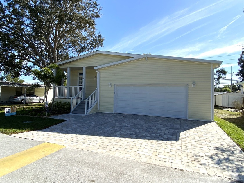 NEW GARAGE HOME REDUCED PRICE!! Age qualified, 55+, land leased - Beach Home for sale in Dunedin, Florida on Beachhouse.com