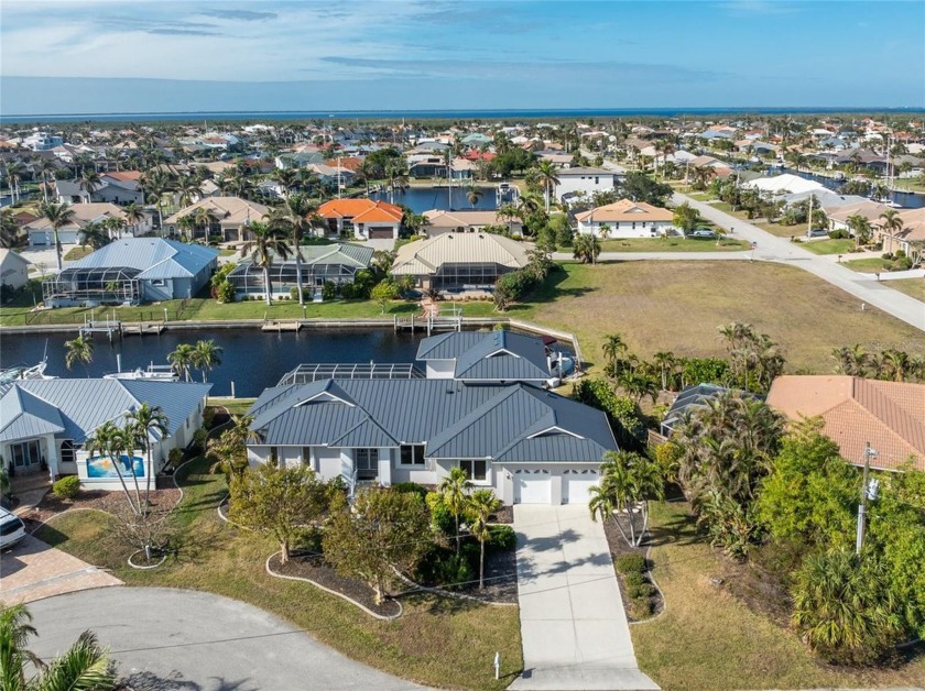 Stunning WATERFRONT home is located on an oversized lot in a - Beach Home for sale in Punta Gorda, Florida on Beachhouse.com