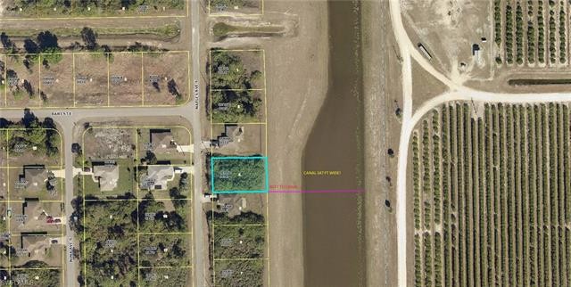 NICE WIDE CANAL LOT, COME AND BUILD YOUR HOME HERE, NOW IS THE - Beach Lot for sale in Lehigh Acres, Florida on Beachhouse.com