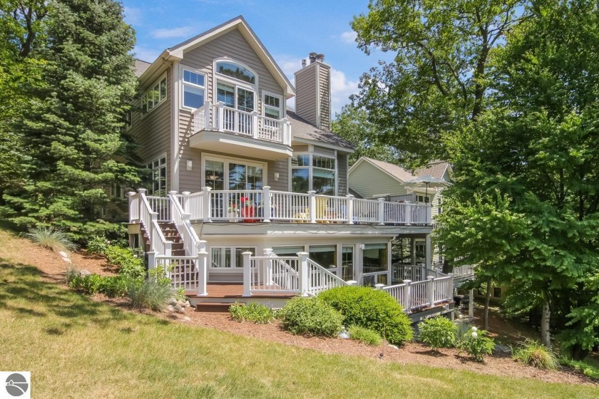 Enjoy golf course and ski hill views from this immaculate 5 - Beach Condo for sale in Glen Arbor, Michigan on Beachhouse.com