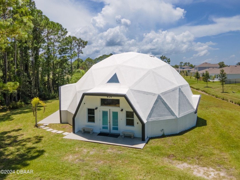 Step into a world of extraordinary living with this one of a - Beach Home for sale in Edgewater, Florida on Beachhouse.com