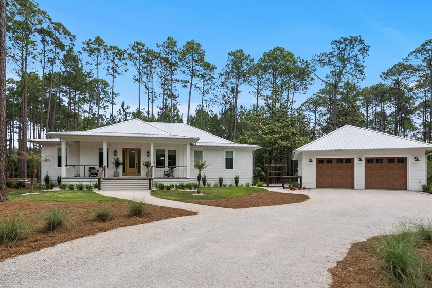 Tucked along a serene .79-acre homesite in one of Panama City - Beach Home for sale in Panama City Beach, Florida on Beachhouse.com