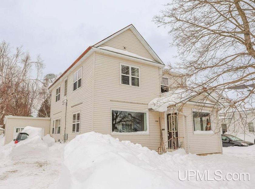 Sitting in a great location just a stone's throw away from - Beach Home for sale in Manistique, Michigan on Beachhouse.com