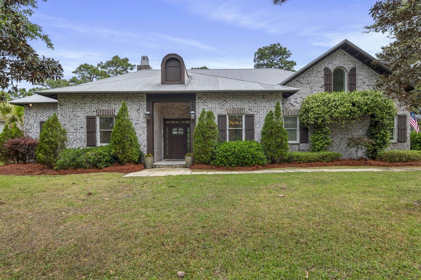 Tucked within the exclusive, gated waterfront community of - Beach Home for sale in Santa Rosa Beach, Florida on Beachhouse.com