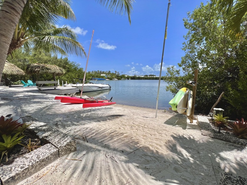 This is it! A rare beach home with boat access to the bay waters - Beach Home for sale in Key Largo, Florida on Beachhouse.com