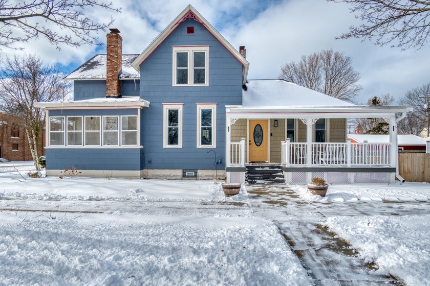 Beautifully updated 1903 home on a spacious corner lot, blending - Beach Home for sale in Ludington, Michigan on Beachhouse.com